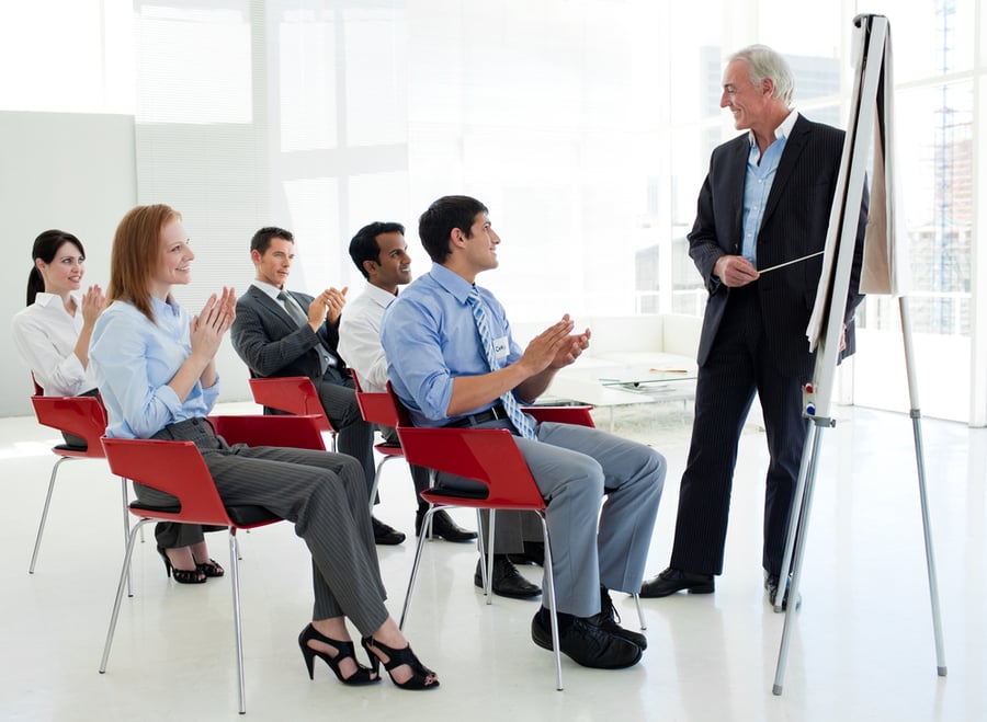Business people applauding in meeting